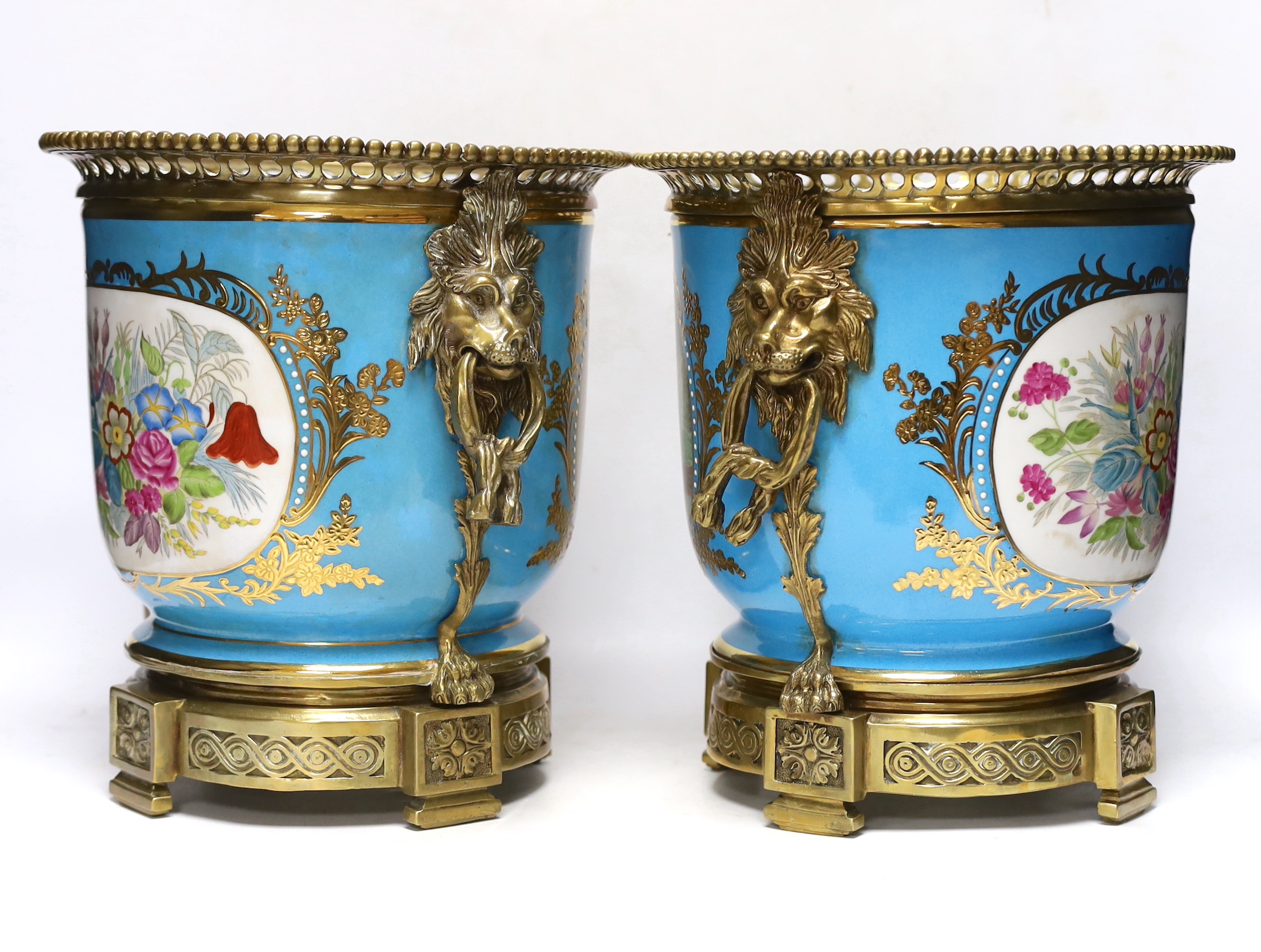 A pair of brass mounted Kusnetzoff style jardinières hand painted with figures, 28cm high